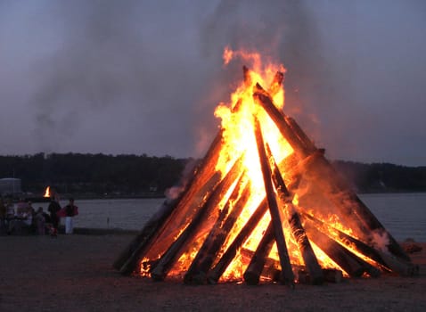 On the shore of the Aabenraa Fjord,many fires burn on the night of 24.6. Solstice bonfires or St. John's bonfires.
