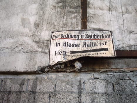 Sign in an abandoned industrial hall. By the way,the name was already crossed out -)
