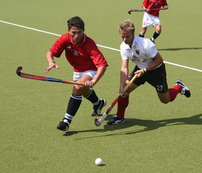 The picture was taken on 24.07.05 at the international hockey match between Germany and Poland. Final score 5:0 for Germany. With the No. 27 the German player Oliver Markowsky,who plays for the Rüsselsheimer RK