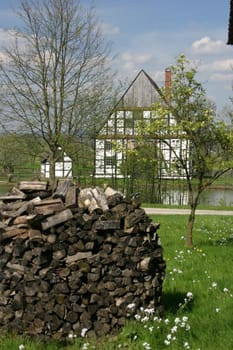 Wooden fin in front of farmhouse