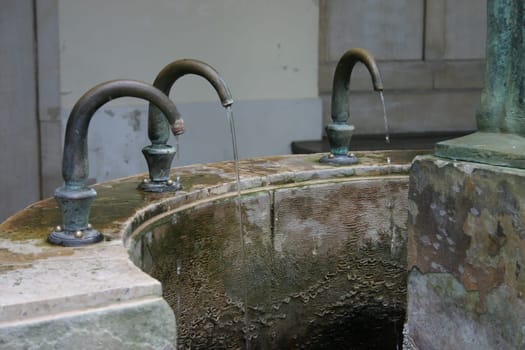 Brunnenhain in the spa gardens of Bad Pyrmont,close-up of the taps