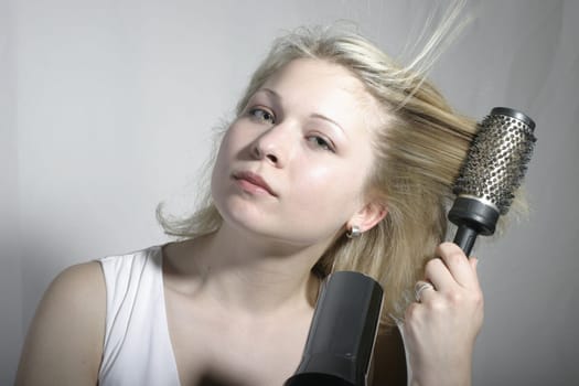 Blow-drying hair with a brush