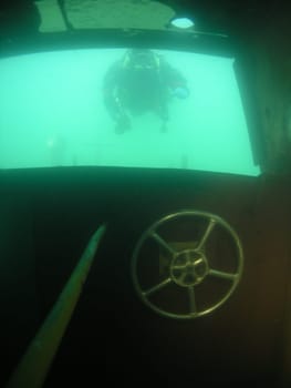 "Hit the wall with the barge!"" and then divers look in the window!"