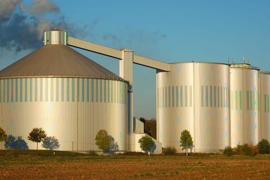 I have found the optimal motif to evoke moiree. The silos are actually metallic grey. My Nikon has come up with some nice color patterns.