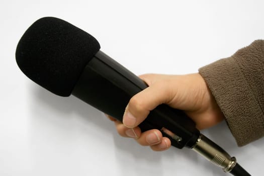 Children's hand with microphone