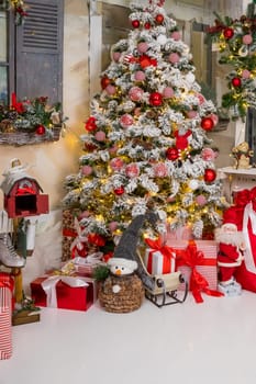 Christmas decorations. Christmas background. Beautiful holiday decorated room with Christmas tree with presents under it