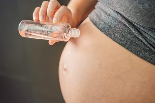 Turkiye, Antalya 02.02.2022: Woman holds Bio Oil, a nurturing choice for pregnant women. A soothing image of care and wellness during pregnancy.