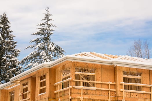 Fragment of townhome complex under construction on winter time