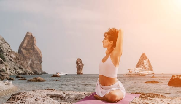 Fitness woman sea. Outdoor workout on yoga mat in park near to ocean beach. Female fitness pilates yoga routine concept. Healthy lifestyle. Happy fit woman exercising with rubber band in park.