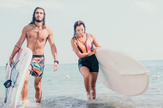 Woman man sea sup. Close up portrait of beautiful young caucasian woman with black hair and freckles looking at camera and smiling. Cute woman portrait in a pink bikini posing on sup board in the sea