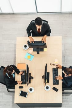 Business people wearing headset shot from top view in office working with computer. Jivy