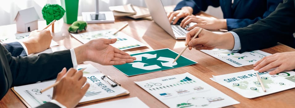 Group of business people planning and discussing on recycle reduce reuse policy symbol in office meeting room. Green business company with eco-friendly waste management regulation concept.Trailblazing