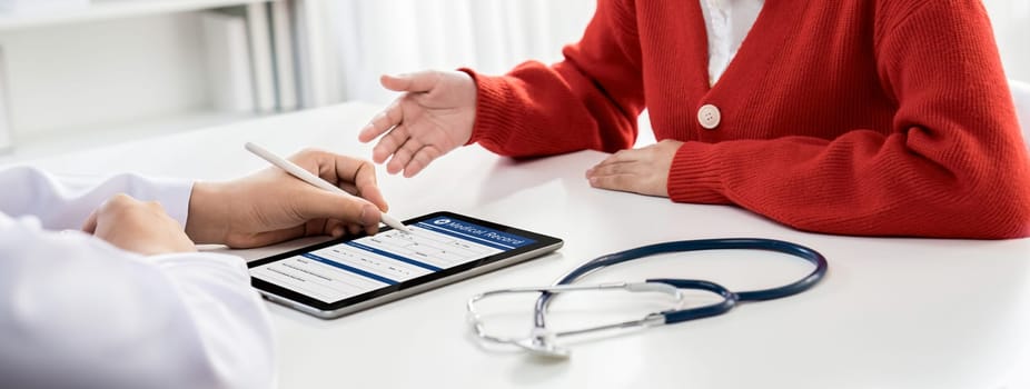 Patient attend doctor's appointment at clinic or hospital office, discussing medical treatment options and explaining examination results or medical record about sickness. Panorama Rigid