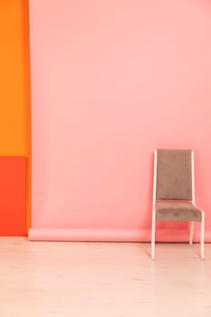 One grey chair in interior on pink background