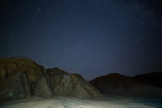 night sedimental mountains at starry night.