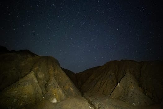 night sedimental mountains at starry night.