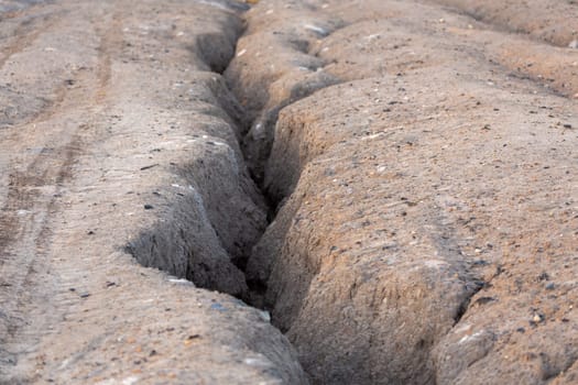 small erosive ravine in weak sandy soil, closeup