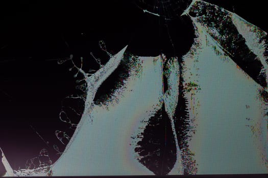 broken lcd tft tn screen flat macro texture with crystal leakage and physical damage cracks, closeup with selective focus and blur.
