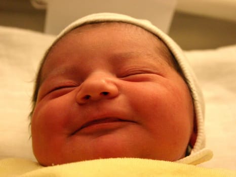 A baby's first smile is called an "angel's smile""... taken shortly after birth."