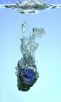 1/4000 second,2 studio flashes,1 aquarium,a clock and me. :)