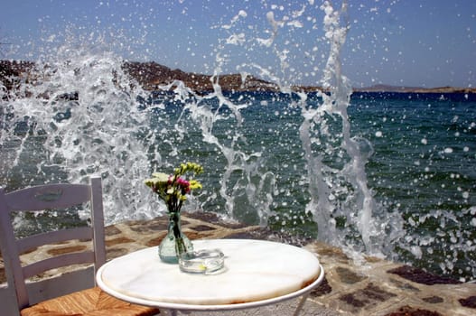 When the ferries arrive in the port of Mykonos,it gets a bit wet in this café...