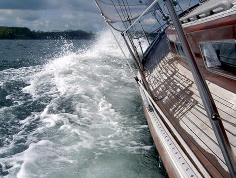 This is what the sailing fan dreams of in the winter season _/)_/)_/) Photo: Flensburg Fjord,therefore no big waves,secured by the life belt and held on to the big boom I stood on the foot rail. Of course,this is only possible when the weather is nice and without a wave