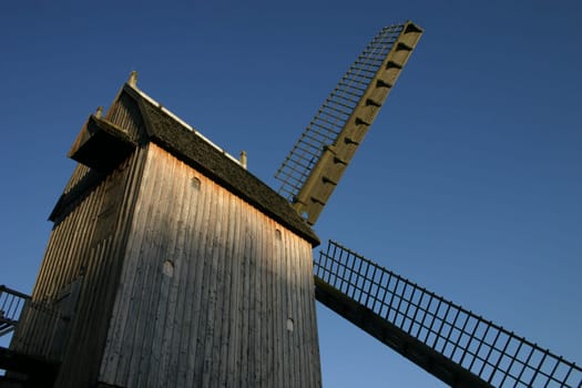 Fixed windmill in the evening sunlight