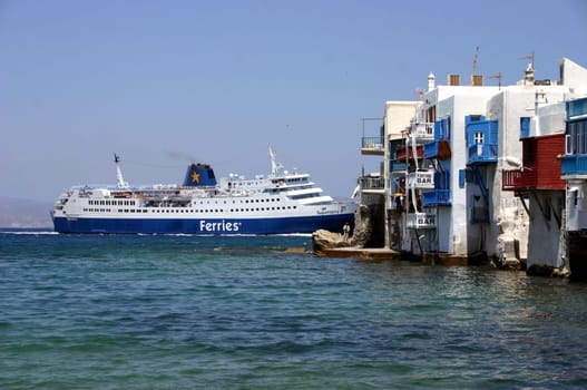 No,the houses were not rammed!! Here you can see a ferry entering the port of Mykonos. The houses are the so-called "Little Venice"" of Mykonos,but the ferry continues behind the houses..."