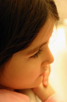 Little girl looks at her newborn little brother...