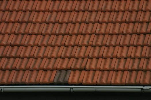 House roof covered with red tiles