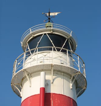 The lighthouse of the small Danish island of Årø. The island has a small harbor and a tiny village. There is a ferry service to the mainland. _/)_/) Cam. Canon Power Shot S2 IS