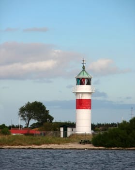 The lighthouse of the small Danish island of Årø. The island has a small harbor and a tiny village. There is a ferry service to the mainland. _/)_/)_/) Cam. Canon Power Shot S2 IS