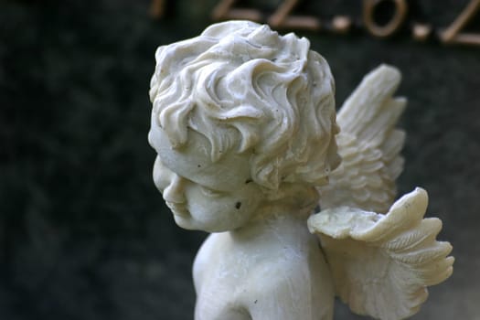 Small marble angel on a grave