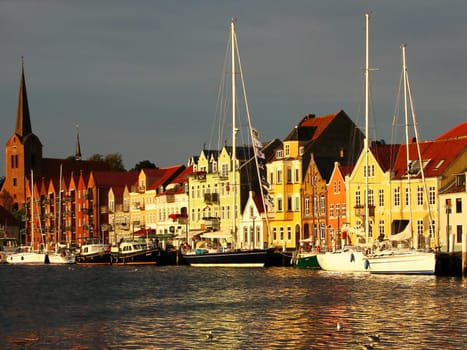 Sønderborg on the island of Als/Denmark. The harbour promenade has recently been renewed. A lot of beautiful wood was used here and a wide staircase was created that goes directly into the water.