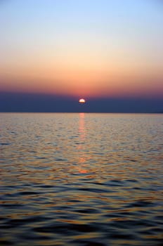 I know there are plenty of sunsets here,but this one I find the water in the foreground so beautiful....