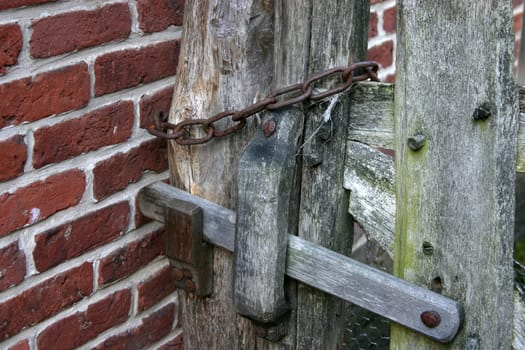 Fence bolt on an old wooden gate
