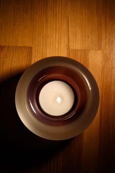 Candle on wood