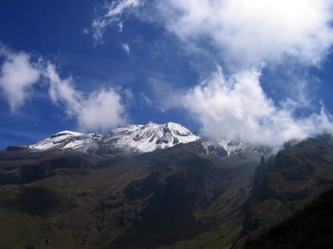 Iztaccihuatl,the sleeping one,sister mountain of the Popocatepetl,is an extinct volcano of 5300 m near Mexico CIty