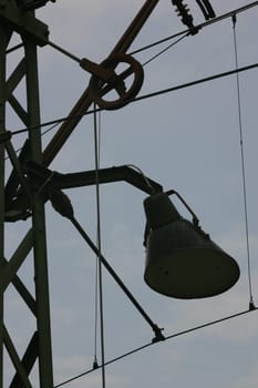 Combined power and lamppost on a railway line