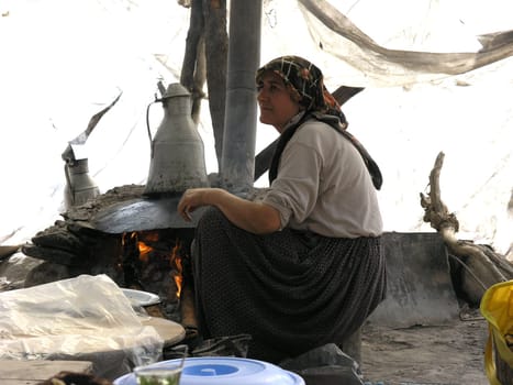 Turkish Rivera Kemer, Woman in tent baking flatbread 2448 x 1836 pixels