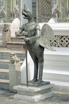 Photo of the "Nok Tuntima"",a Thai mythical creature consisting of man and bird. Photographed in the temple complex of Wat Phra Kaeo in Bangkok.  Scan from the negative"