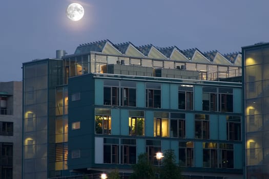 Moon over residential buildings