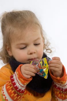 Child looks into an empty bag of sweets