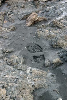 Footprint in the ashes of Mount Etna near Zafferano (Sicily)