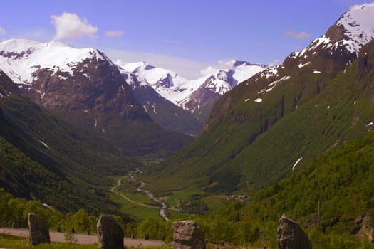 Here is another holiday souvenir from Norway.This photo was taken on one of the few sunny days last year. It shows the serpentine road between Styn (Western Norway) and the Stryn summer ski center. The mountains in the surrounding area belong to the Anfan