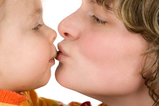Mother gives daughter a kiss