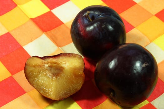 Plums on a checkered support