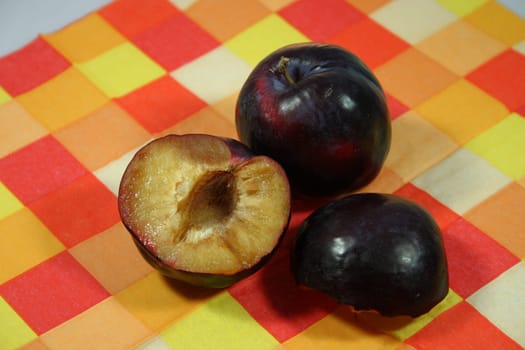 Plums on a checkered support