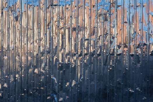 damaged zinc plated corrugated steel sheet full frame background and texture.