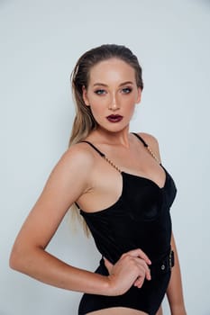 woman in black swimsuit on white background